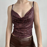 Brown sequin top worn by a mannequin against a plain background