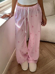 Women's pink striped high-waist lounge pants.