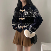 Person wearing a dark blue patterned cardigan and brown skirt holding a white plush toy.