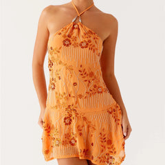 Orange halter neck dress with floral patterns
