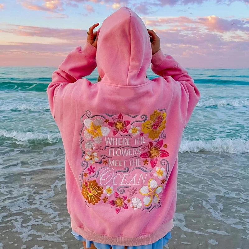 Women's floral letter embroidery hoodie with a loose fit and kangaroo pocket.