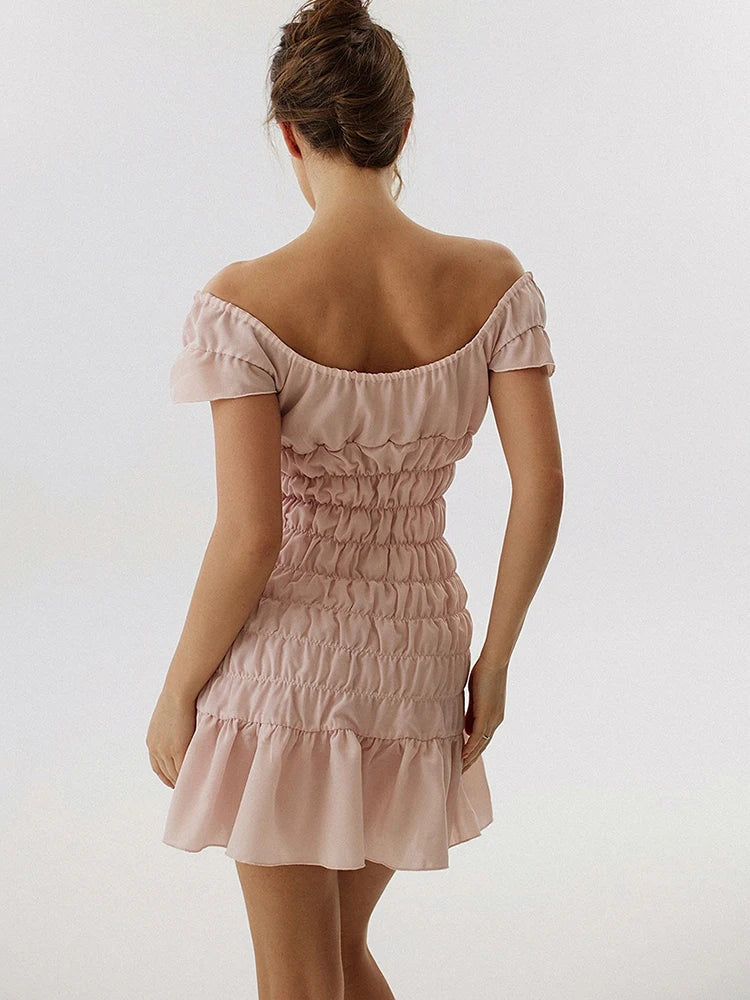 Woman wearing a pink off-shoulder dress - back view