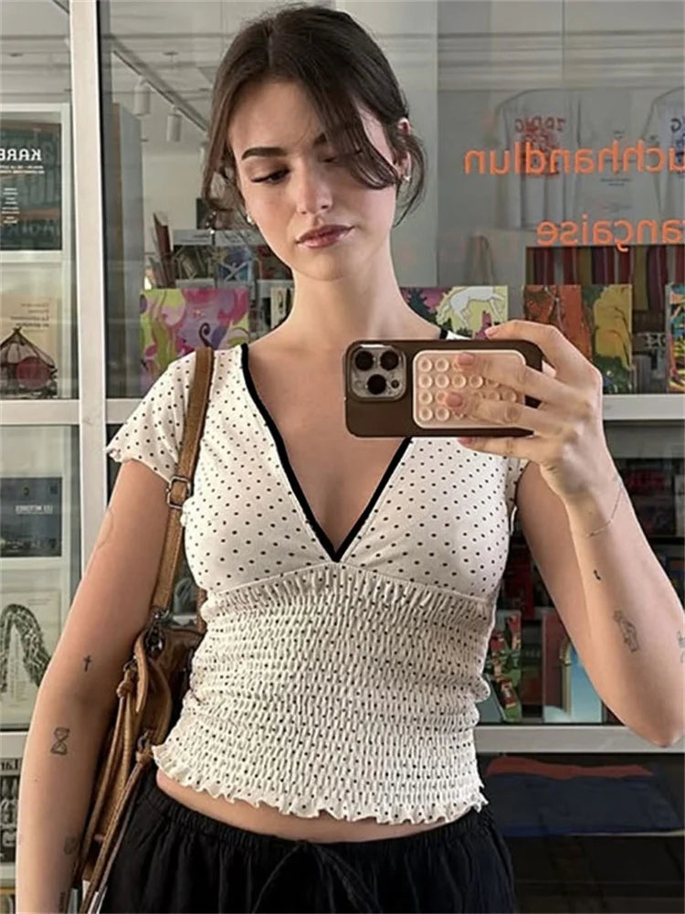 Women's white V-neck printed short sleeve top.