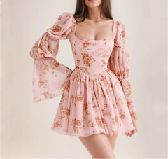  Women's floral dress with long puff sleeves and a square neckline.