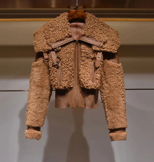 Brown shearling jacket on a hanger against a neutral background