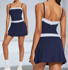 Navy blue dress with white accents worn by a model on a plain background
