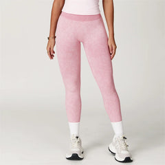 Person wearing pink leggings and white sneakers - front view