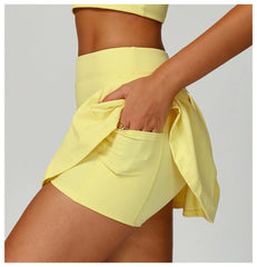 Person wearing a yellow outfit with a skirt 