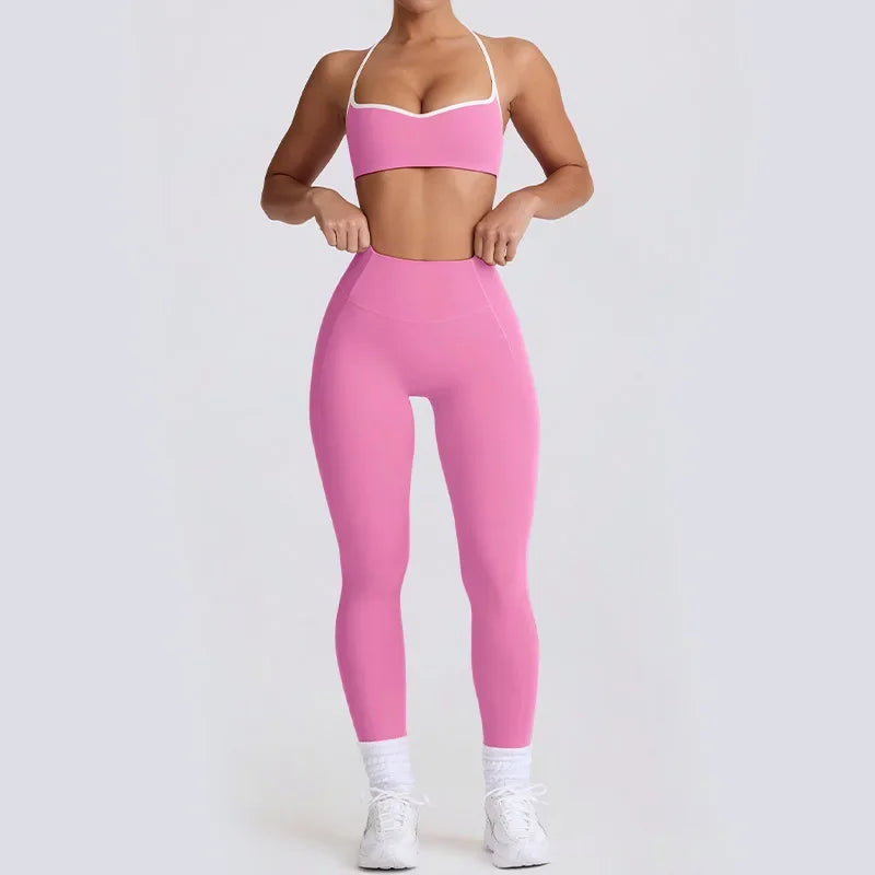 Person wearing a pink sports bra and leggings set 