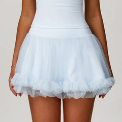 Light blue tulle skirt worn by a person on a plain background