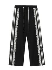 Black pants with white stripes and lace detailing 