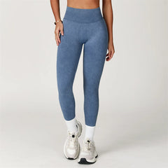 Person wearing blue leggings and white sneakers - full view