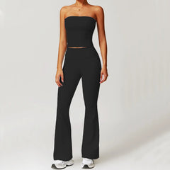 Person wearing a black strapless top and high-waisted pants- front view