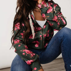 Person wearing a floral jacket with pink flowers 