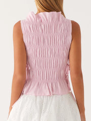 Pink sleeveless top worn by model - back view