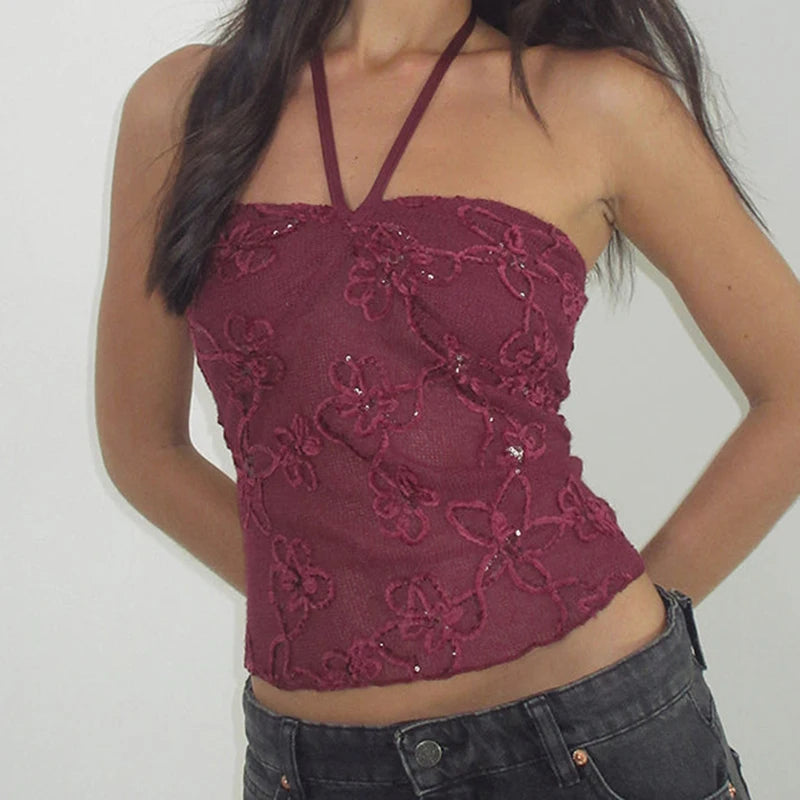 Maroon embroidered halter top worn by a person against a plain background