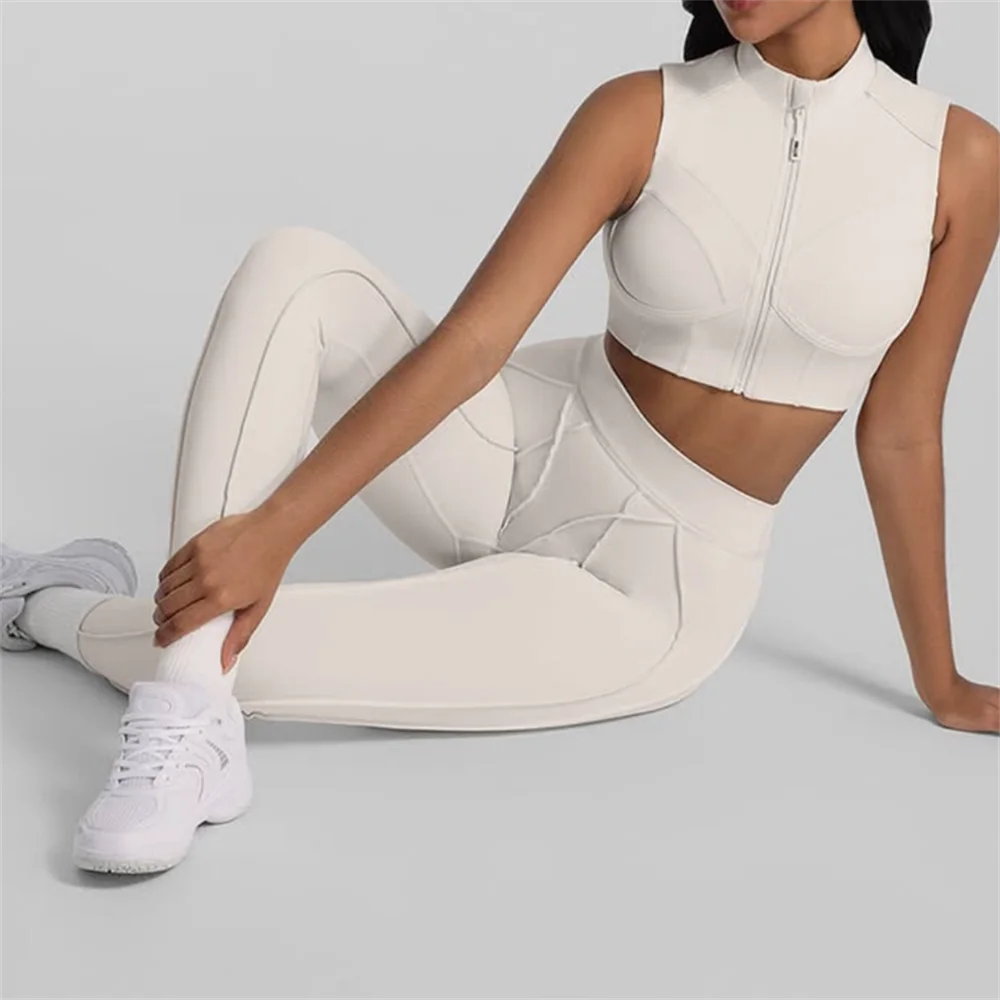 Person wearing a white athletic outfit sitting 