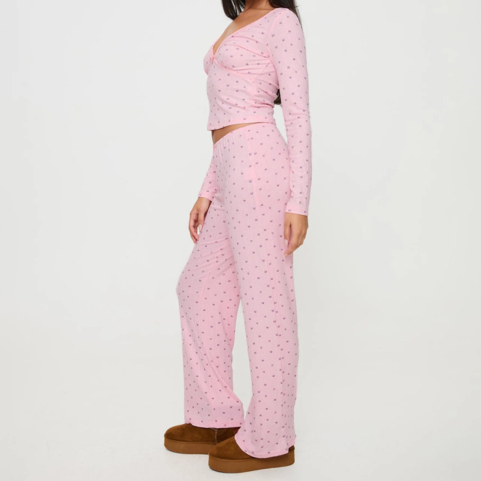 Person wearing a pink long-sleeve top and pants set 