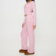 Person wearing a pink long-sleeve top and pants set 