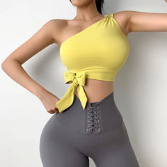 Person wearing a yellow top and gray leggings 