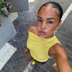 A one-shoulder crop top with a drawstring and ruched detailing.