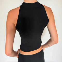 Black halter top worn by a person - back