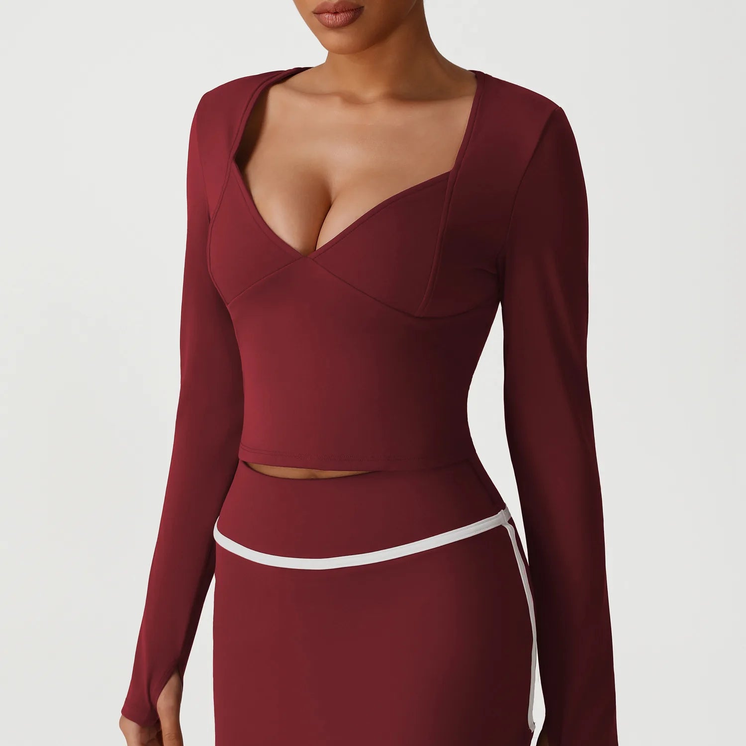 Maroon long-sleeve dress with cut-out design