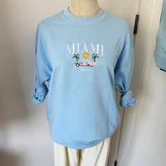  Women's Miami embroidered sweatshirt with an automobile graphic.