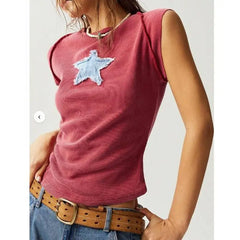 Model displaying a short round neck tank top with star appliques in a patchwork pattern.