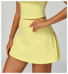 Person wearing a yellow skirt on a plain background