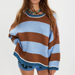 Person wearing a brown and blue striped sweater with matching shorts 