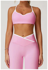 Person wearing a pink sports bra and leggings set -front view