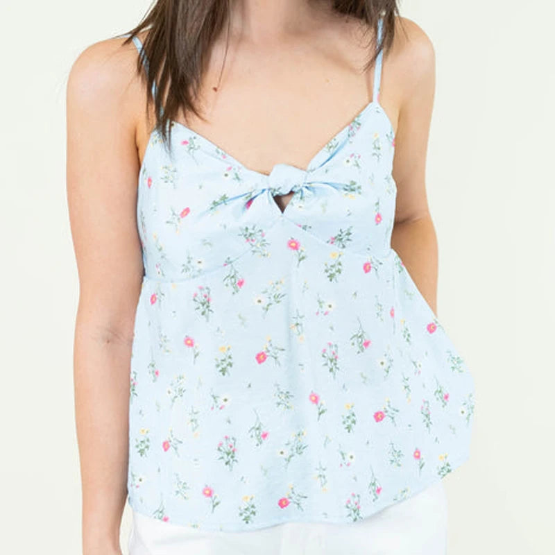 Light blue floral sleeveless top worn by a person