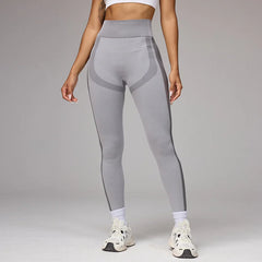 Person wearing gray leggings with mesh panels