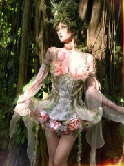Ethereal woodland fairy corset dress with floral appliqués and sheer chiffon sleeves in blush pink and moss green