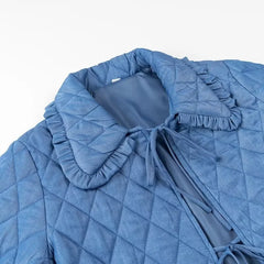 A stylish blue quilted jacket with a cozy collar and a zipper closure.