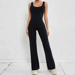 Person wearing a black jumpsuit - full view