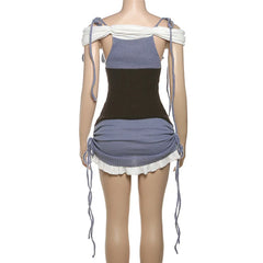 Mannequin wearing a black and blue dress with white accents on a white background