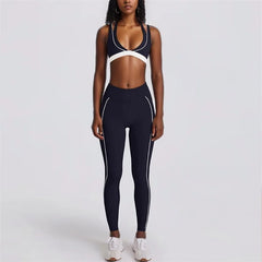 Person wearing a black and white sports bra and leggings set- full view