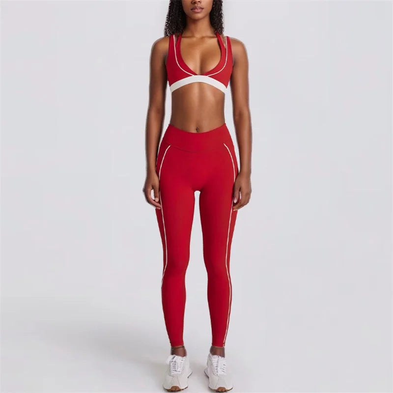 Person wearing a red athletic outfit with white accents