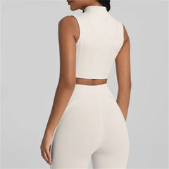 Person wearing a white sleeveless top and pants- back view