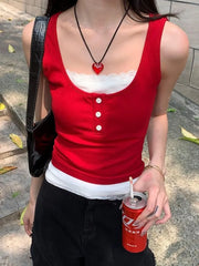 Women's white layered tank top with button details.