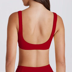 Red open-back top worn by a person - back view