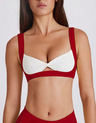Red and white bra worn by a model - close-up