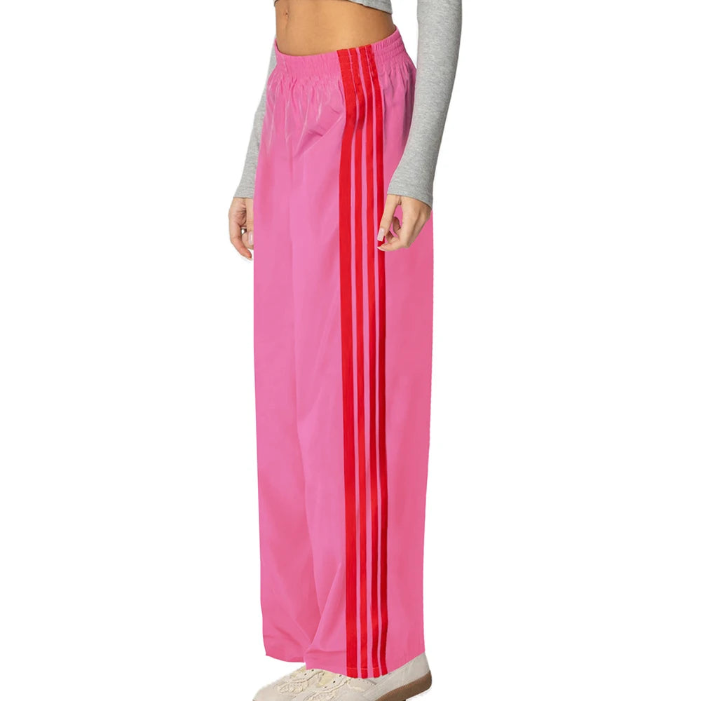 Pink pants with red stripes worn by a person 