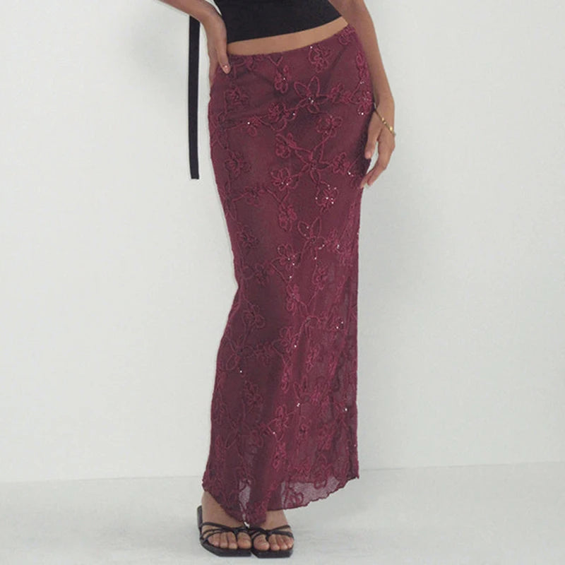 Maroon lace skirt worn by a person on a white background