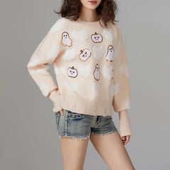 Person wearing a sweater with cartoon character designs on a plain background