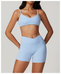 Person wearing a light blue sports bra and shorts set 