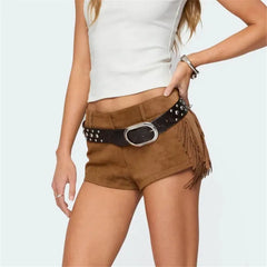Brown shorts with a studded belt worn by a person on a light gray background