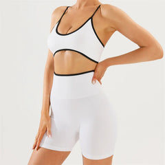 White sports bra and shorts with black trim 